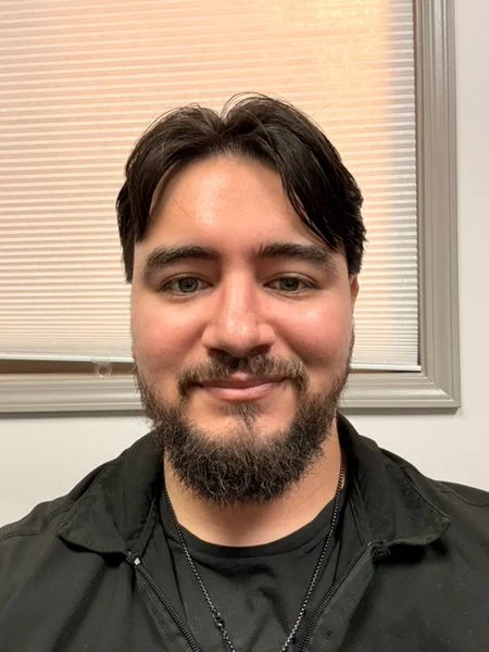 Luis A., barber at PLATA Barbershop
